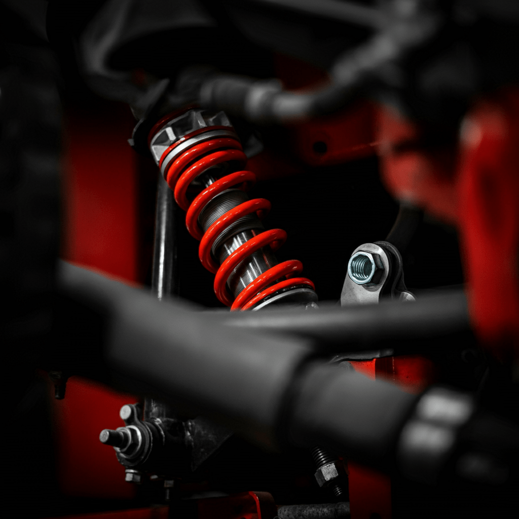 Mechanic repairing vehicle suspension